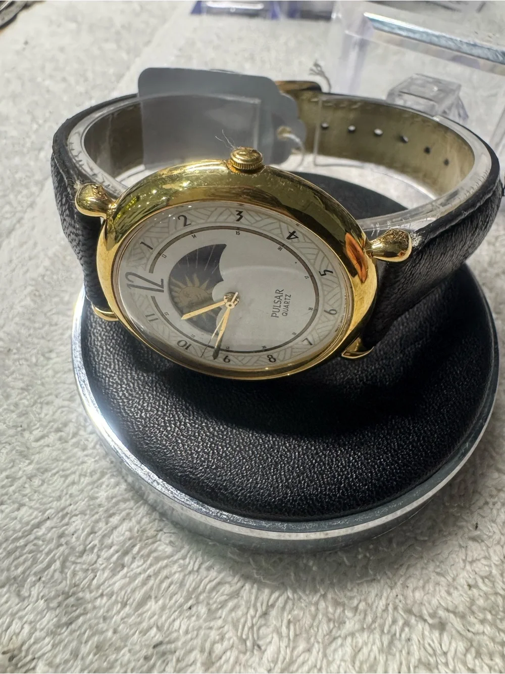 Pulsar Gold Tone Watch with White Dial and Black Strap